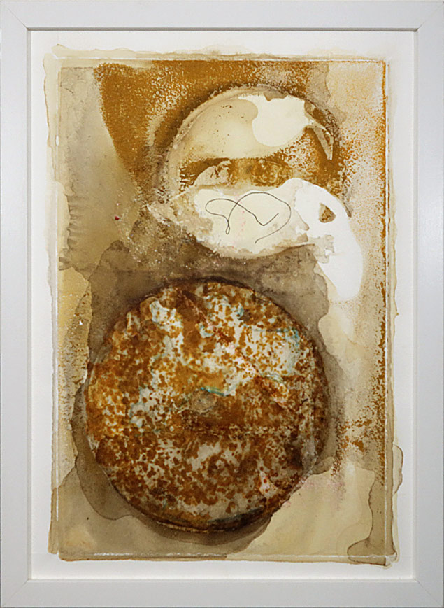 An abstract artwork featuring the prominent circular shape of a concrete saw with a smaller softer disk shape above. These are layered with natural dye textures in brown and cream.