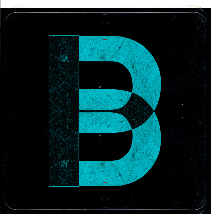 Looks like a stylised letter 'B' in a textured teal colour on a black background. It is in fact a scan of a magnetic drivers P plate, digitally duplicated and flipped then the colour altered. 