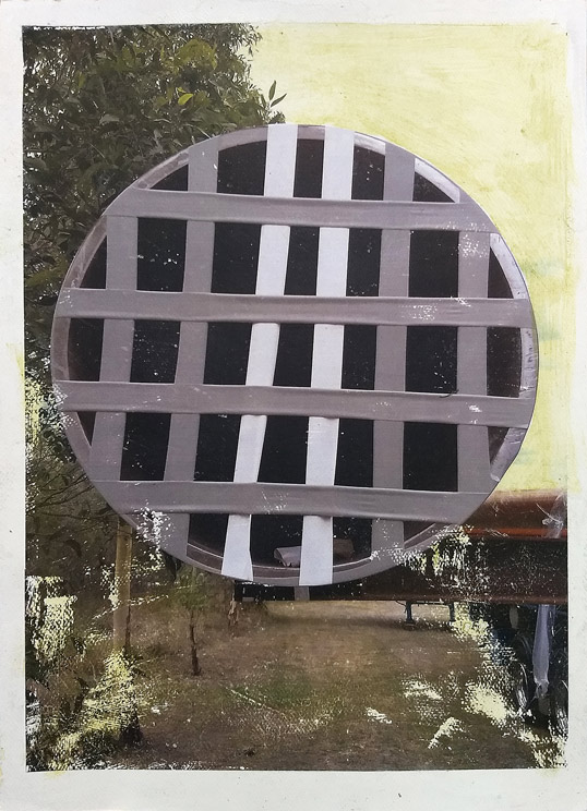 an abstract image which is actually a Photo of a large pipe on a truck with a grid of grey tape across its opening